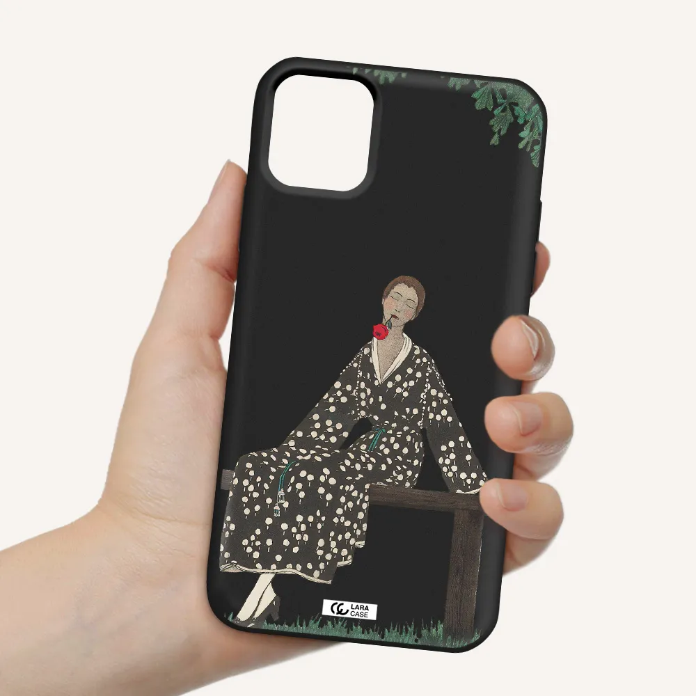 a woman sitting on a bench Apple iPhone 11 Silicone black Case