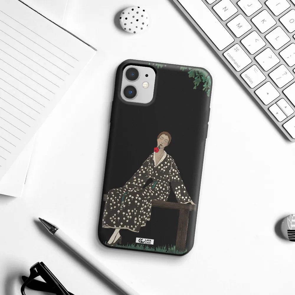 a woman sitting on a bench Apple iPhone 11 Silicone black Case