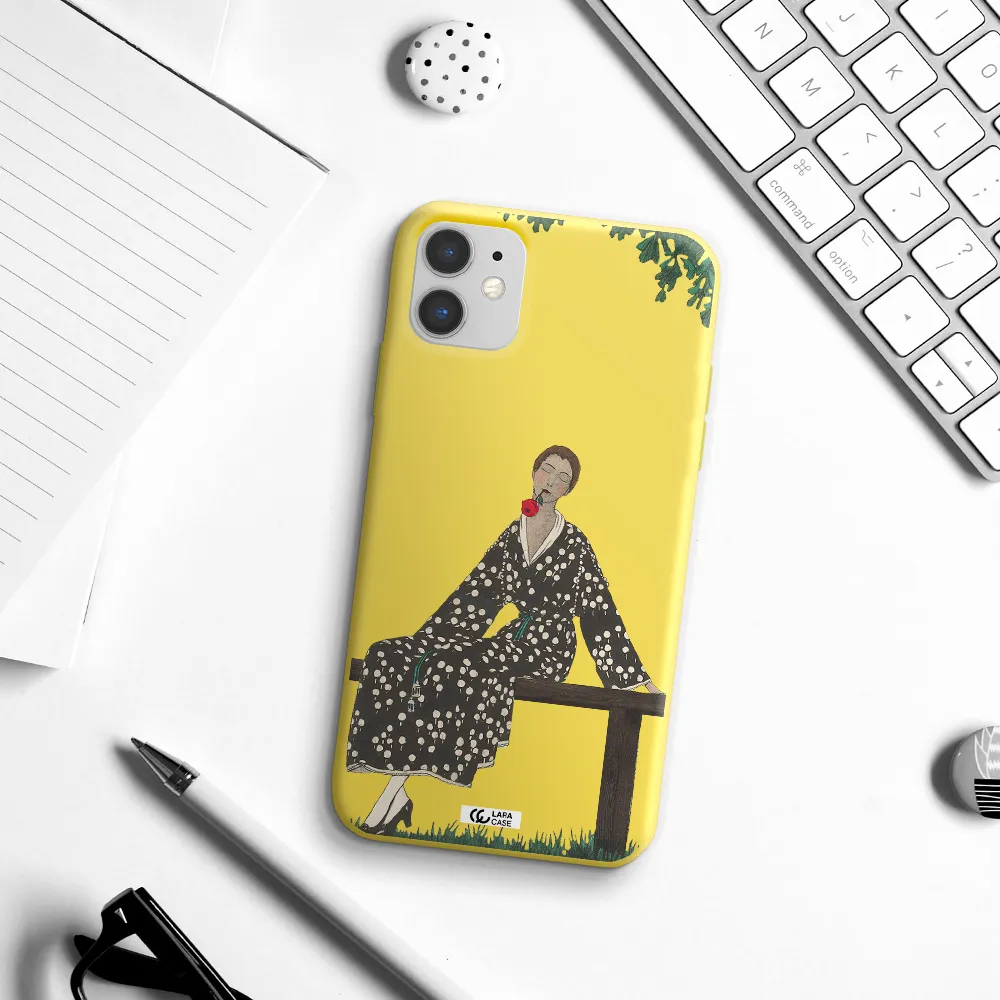 a woman sitting on a bench Apple iPhone 11 Silicone canary yellow Case