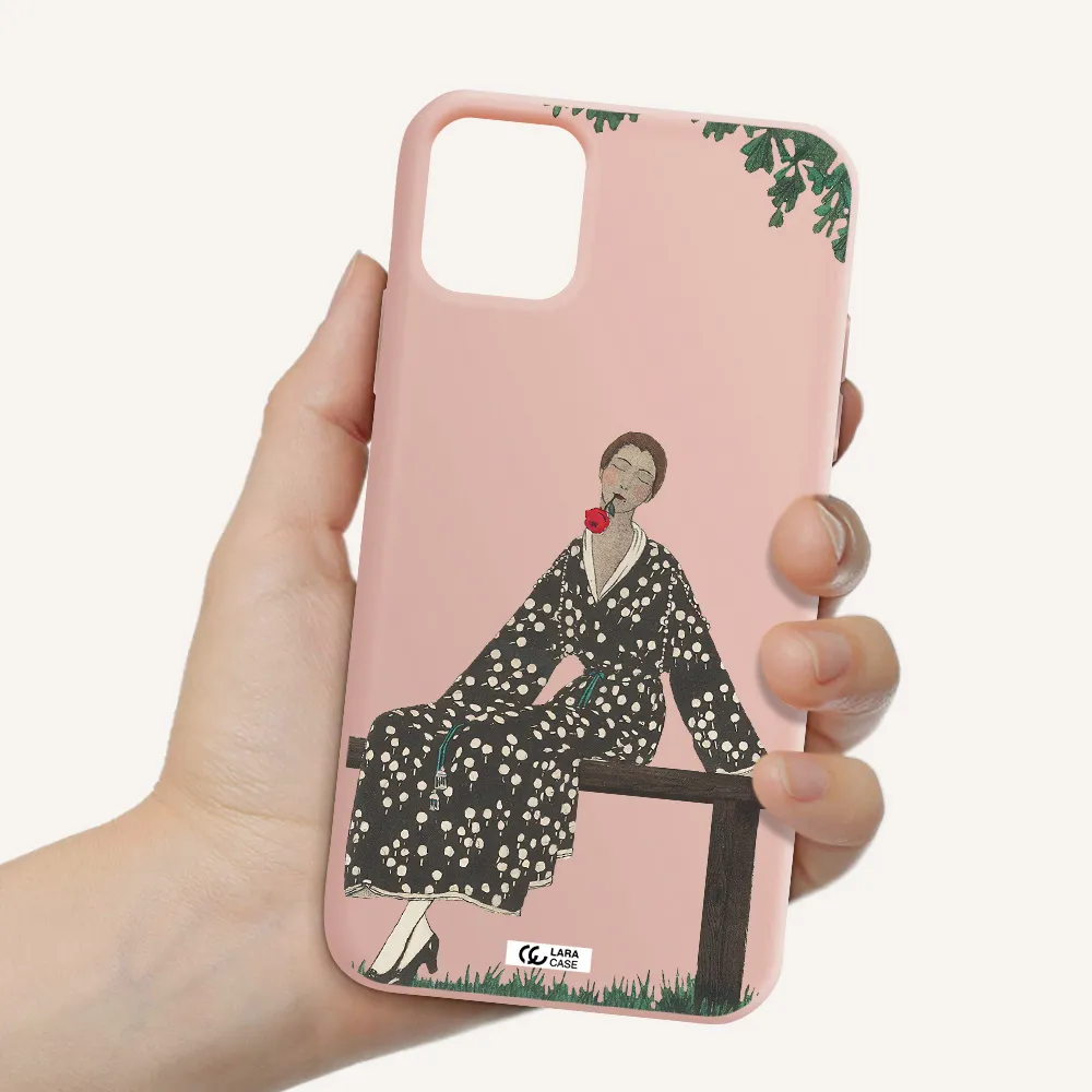 a woman sitting on a bench Apple iPhone 11 Silicone pastel pink Case