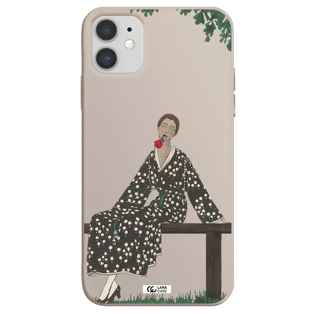 a woman sitting on a bench Apple iPhone 11 Silicone Stone Case