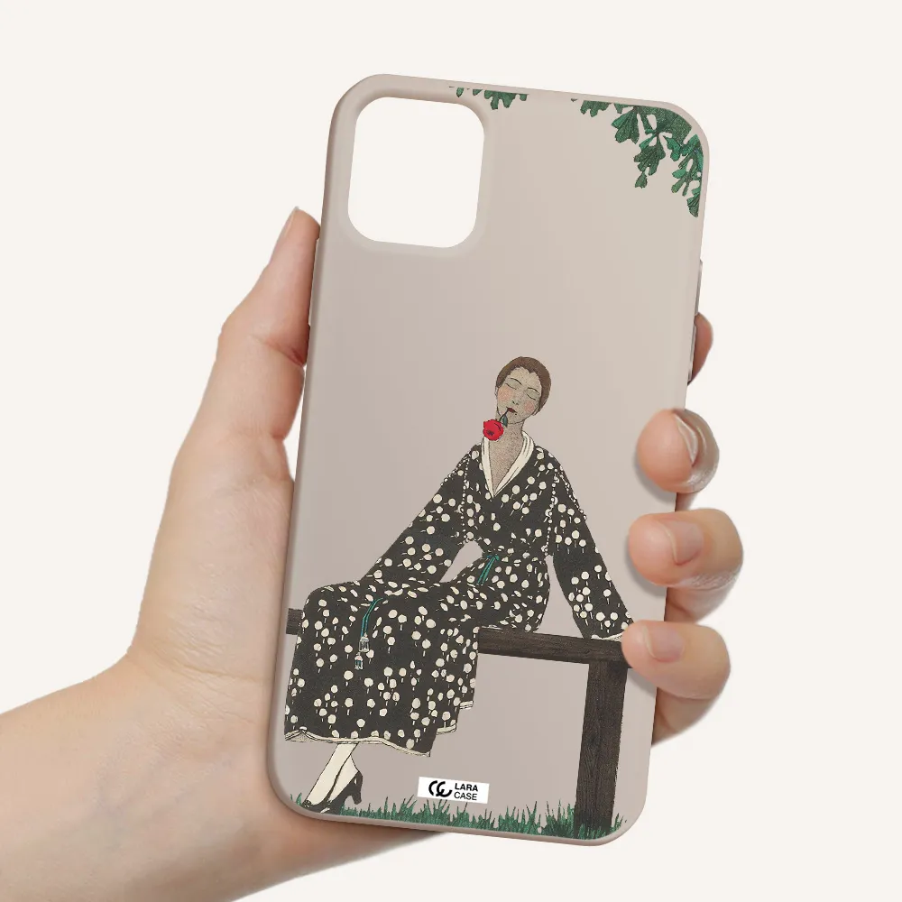 a woman sitting on a bench Apple iPhone 11 Silicone Stone Case