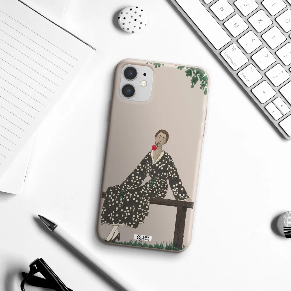 a woman sitting on a bench Apple iPhone 11 Silicone Stone Case
