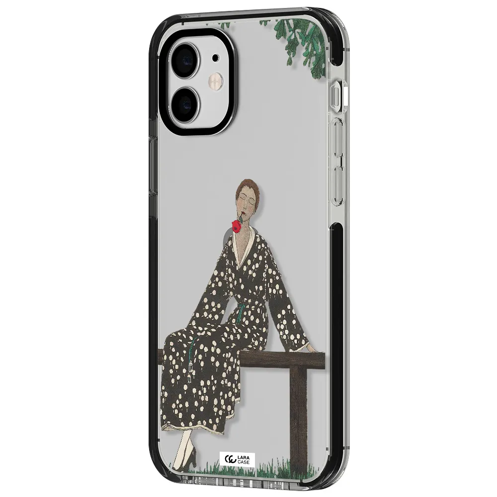 a woman sitting on a bench Apple iPhone 12 impact black border Case