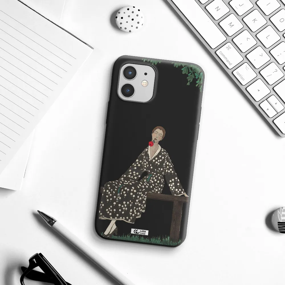 a woman sitting on a bench Apple iPhone 12 mini Silicone black Case