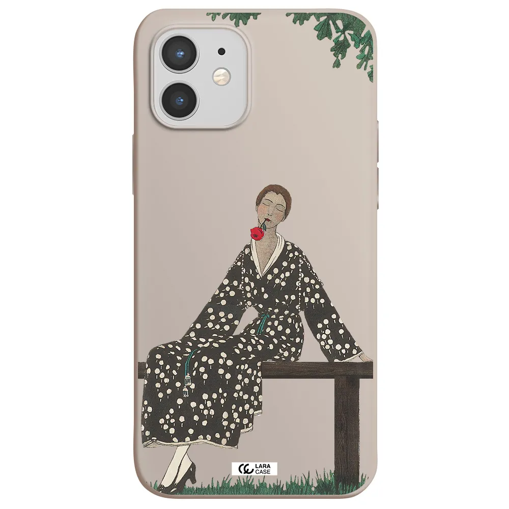 a woman sitting on a bench Apple iPhone 12 mini Silicone Stone Case