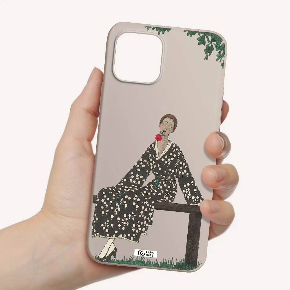 a woman sitting on a bench Apple iPhone 12 mini Silicone Stone Case