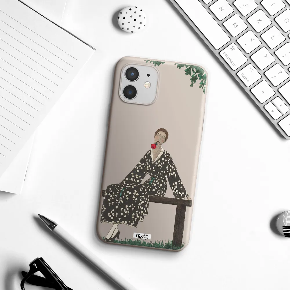 a woman sitting on a bench Apple iPhone 12 mini Silicone Stone Case