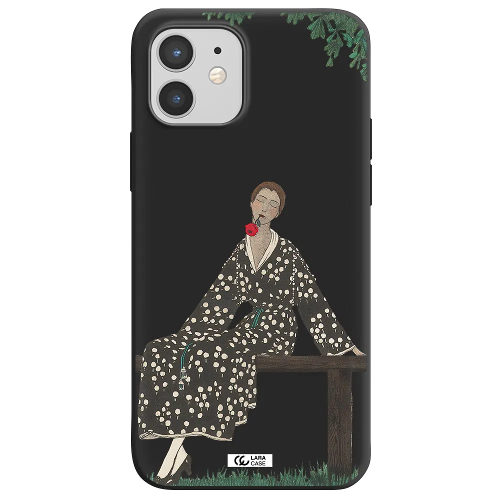 a woman sitting on a bench Apple iPhone 12 Silicone black Case