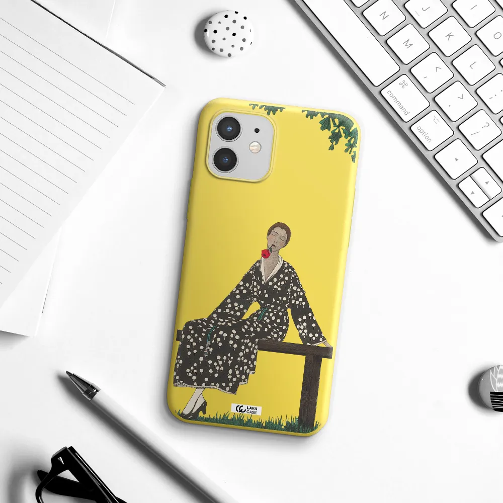 a woman sitting on a bench Apple iPhone 12 Silicone canary yellow Case