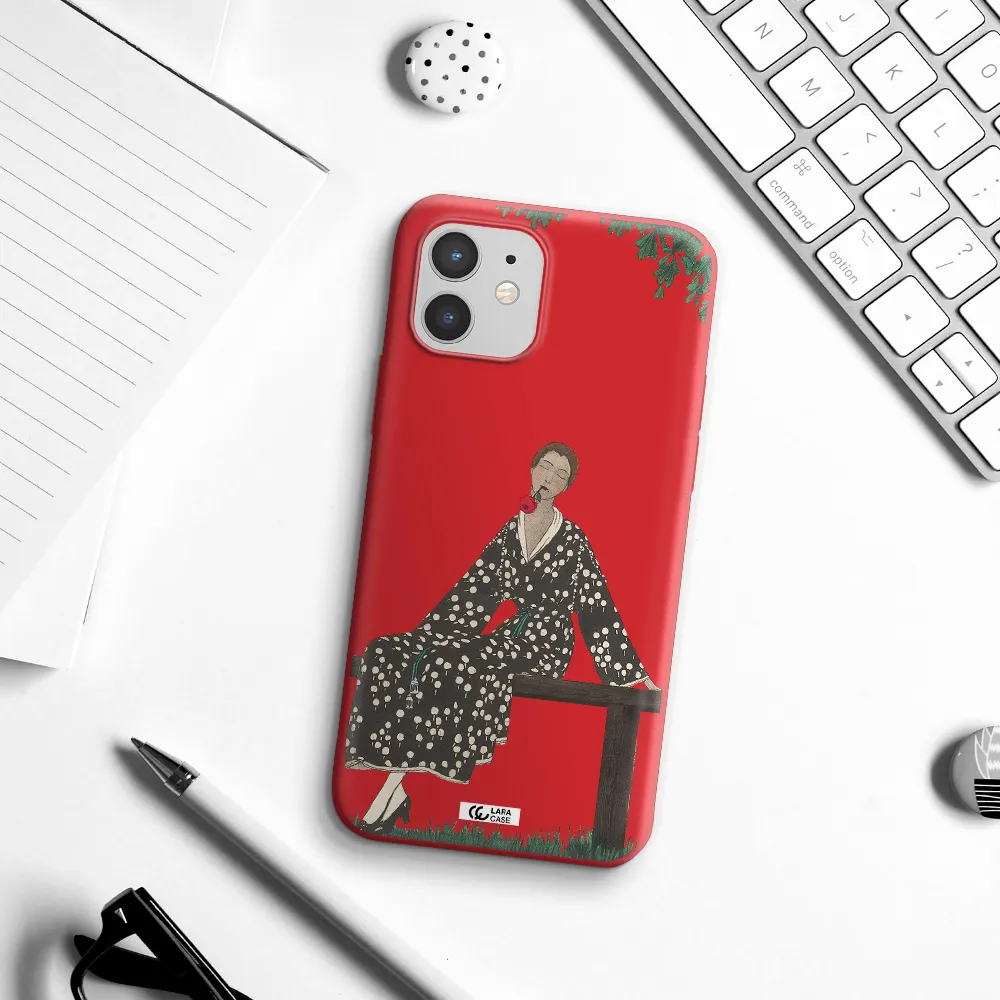 a woman sitting on a bench Apple iPhone 12 Silicone Imperial Red Case