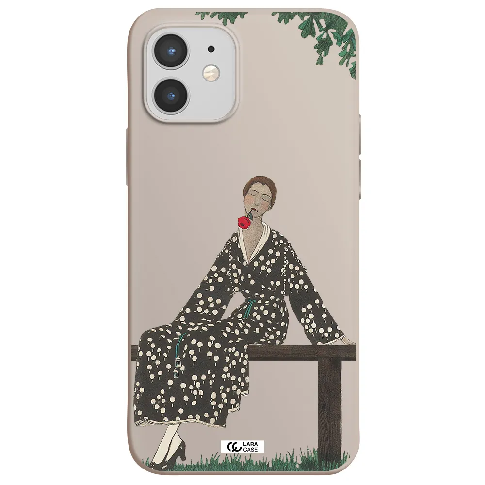 a woman sitting on a bench Apple iPhone 12 Silicone Stone Case
