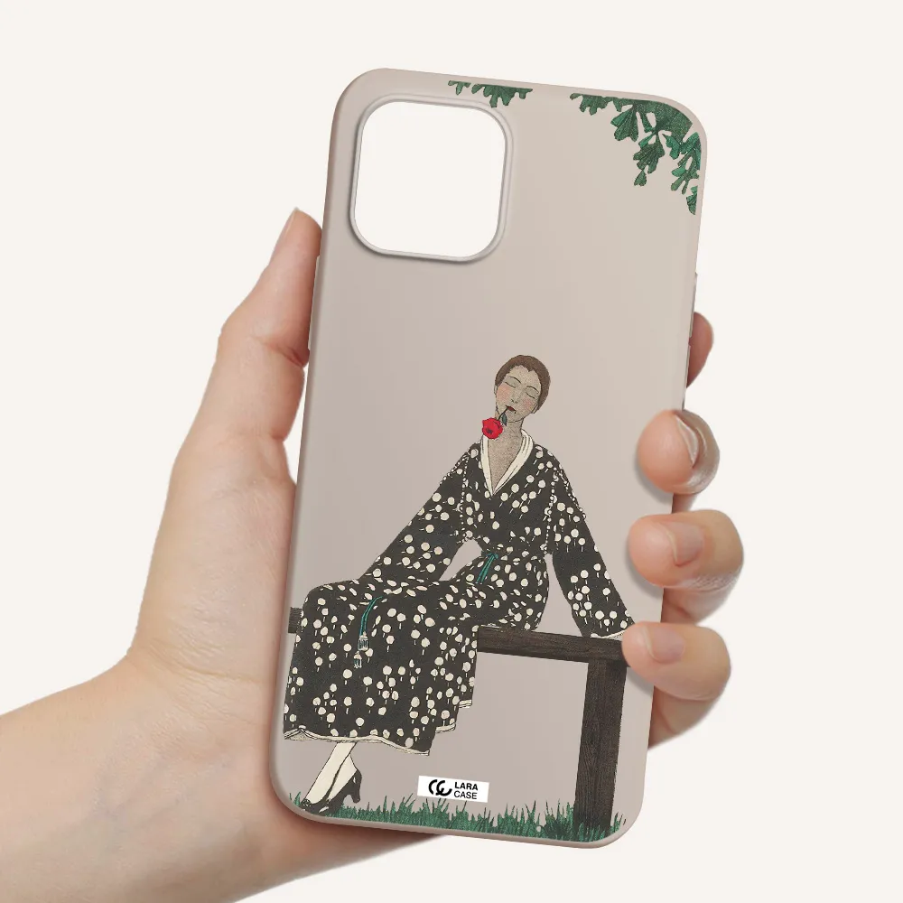 a woman sitting on a bench Apple iPhone 12 Silicone Stone Case