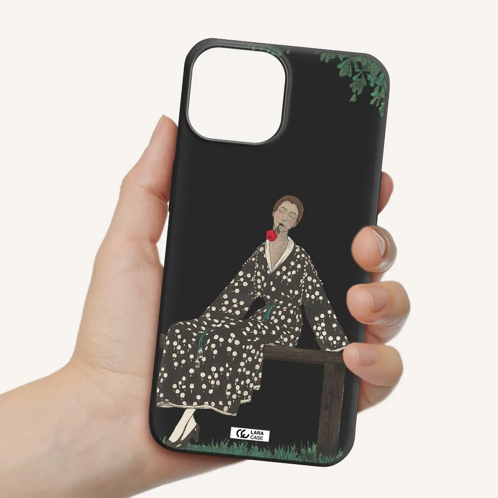 a woman sitting on a bench Apple iPhone 13 mini Silicone black Case