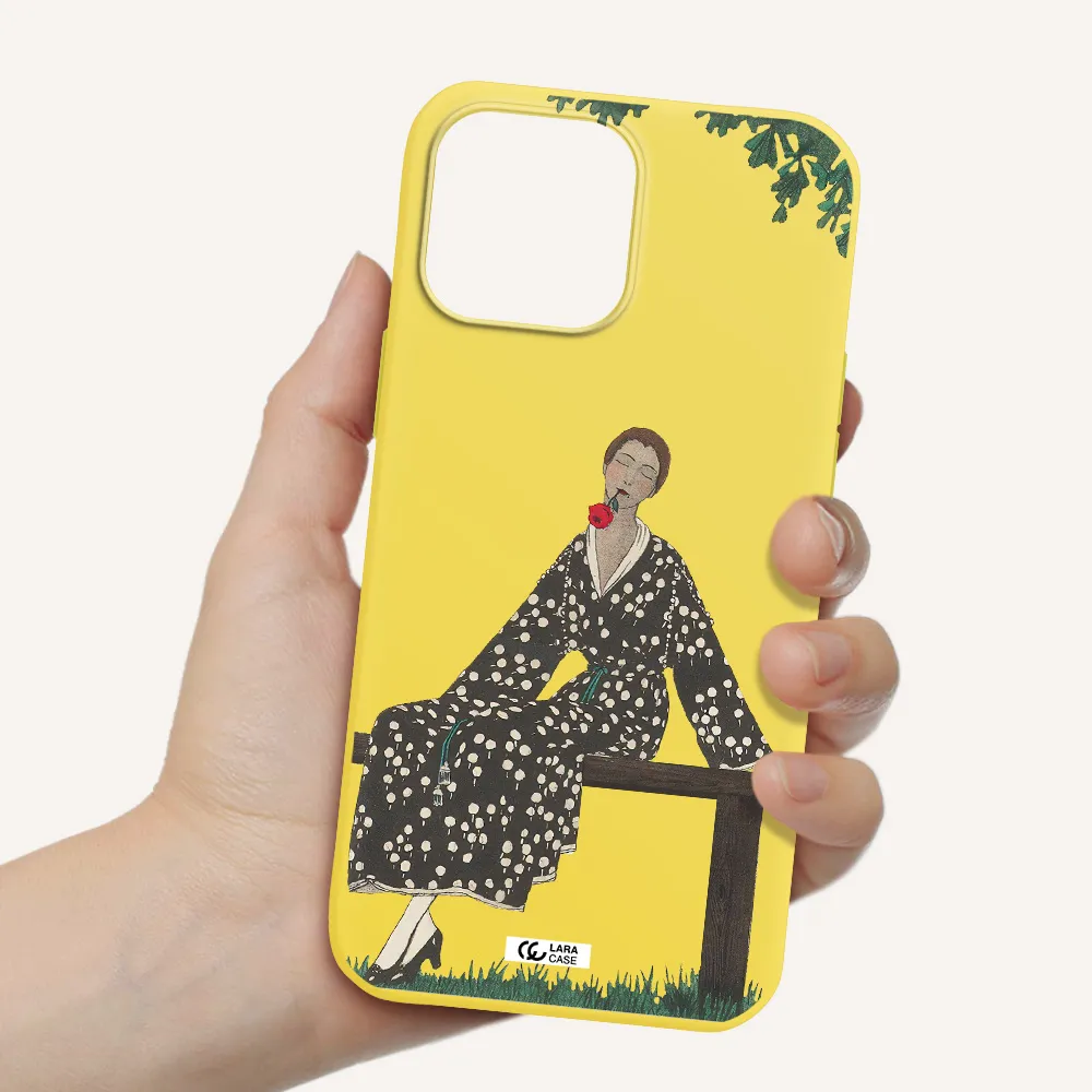 a woman sitting on a bench Apple iPhone 13 Pro Max Silicone canary yellow Case