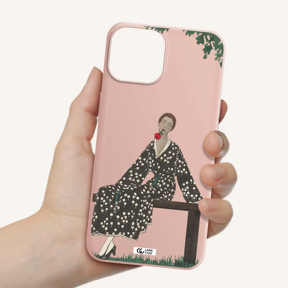 a woman sitting on a bench Apple iPhone 13 Silicone pastel pink Case