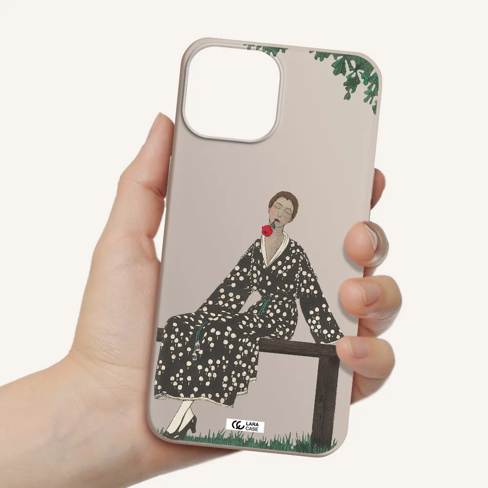 a woman sitting on a bench Apple iPhone 13 Silicone Stone Case