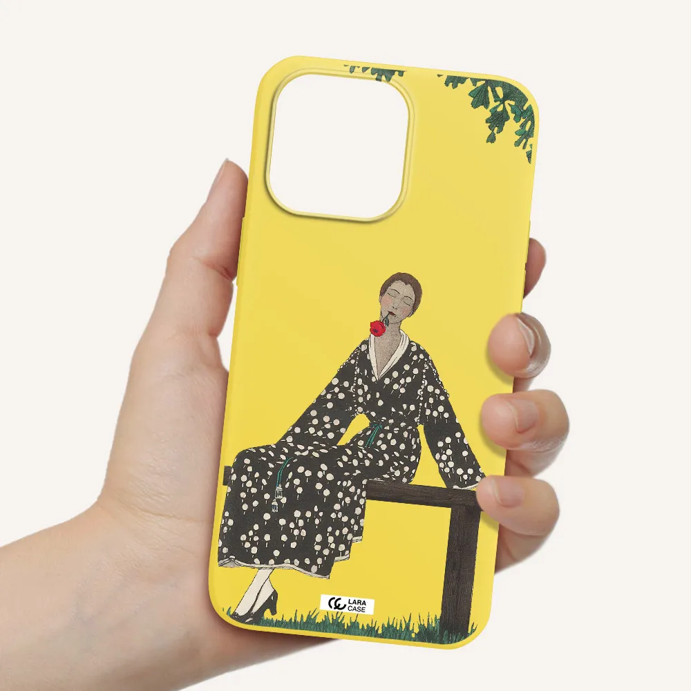 a woman sitting on a bench Apple iPhone 14 pro max Silicone canary yellow Case