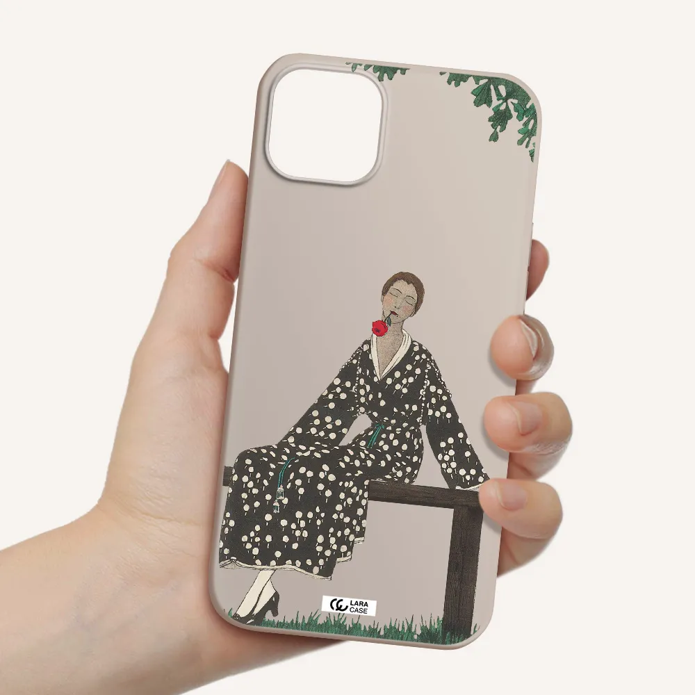 a woman sitting on a bench Apple iPhone 14 Silicone Stone Case