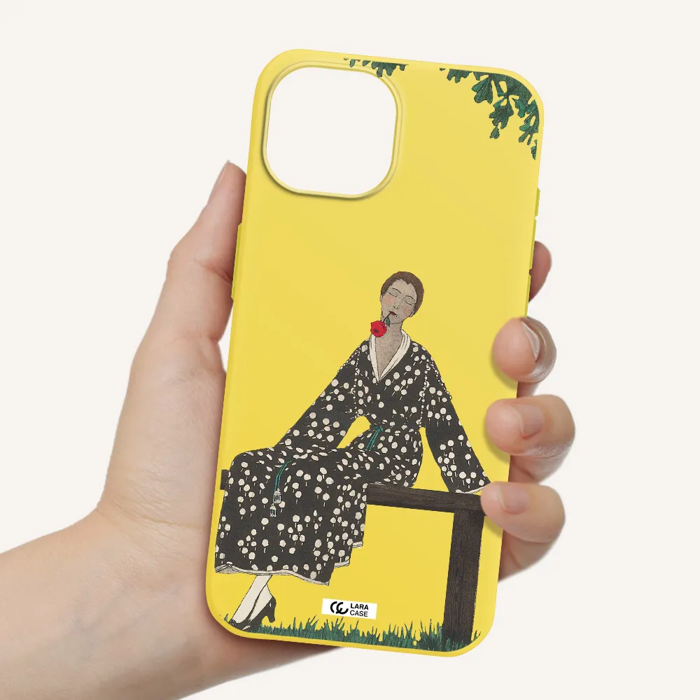 a woman sitting on a bench Apple iPhone 15 Silicone canary yellow Case