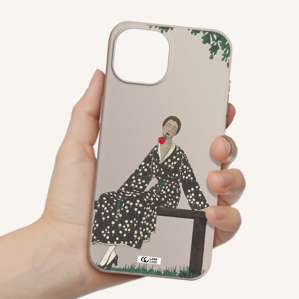 a woman sitting on a bench Apple iPhone 15 Silicone Stone Case