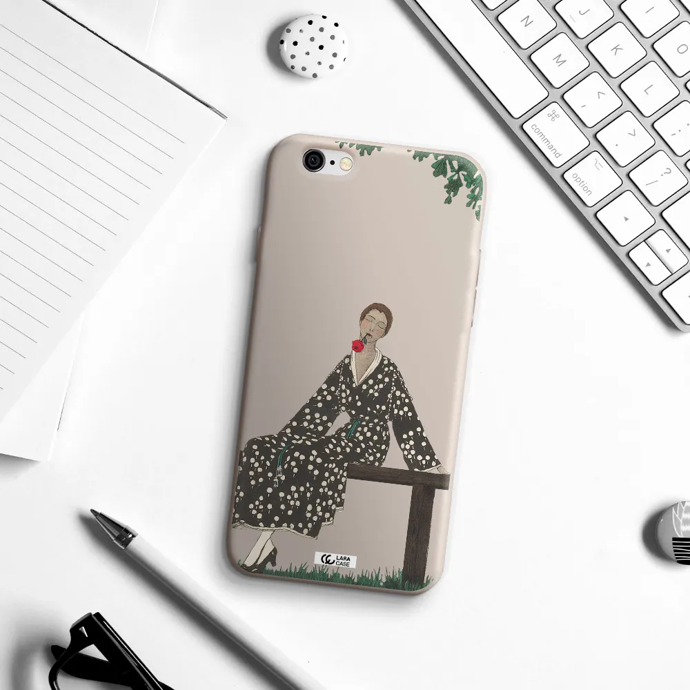 a woman sitting on a bench Apple iPhone 6 Silicone Stone Case