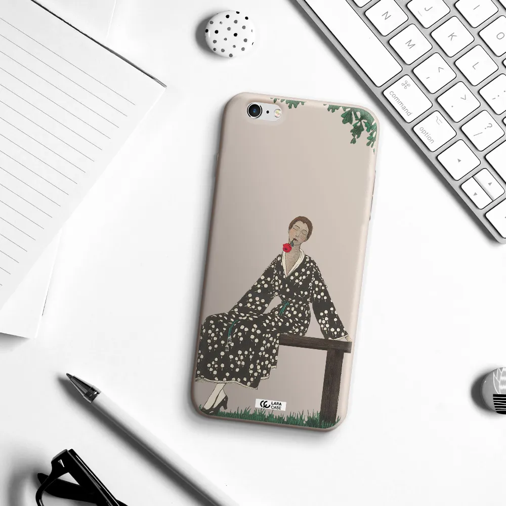 a woman sitting on a bench Apple iPhone 6S Silicone Stone Case