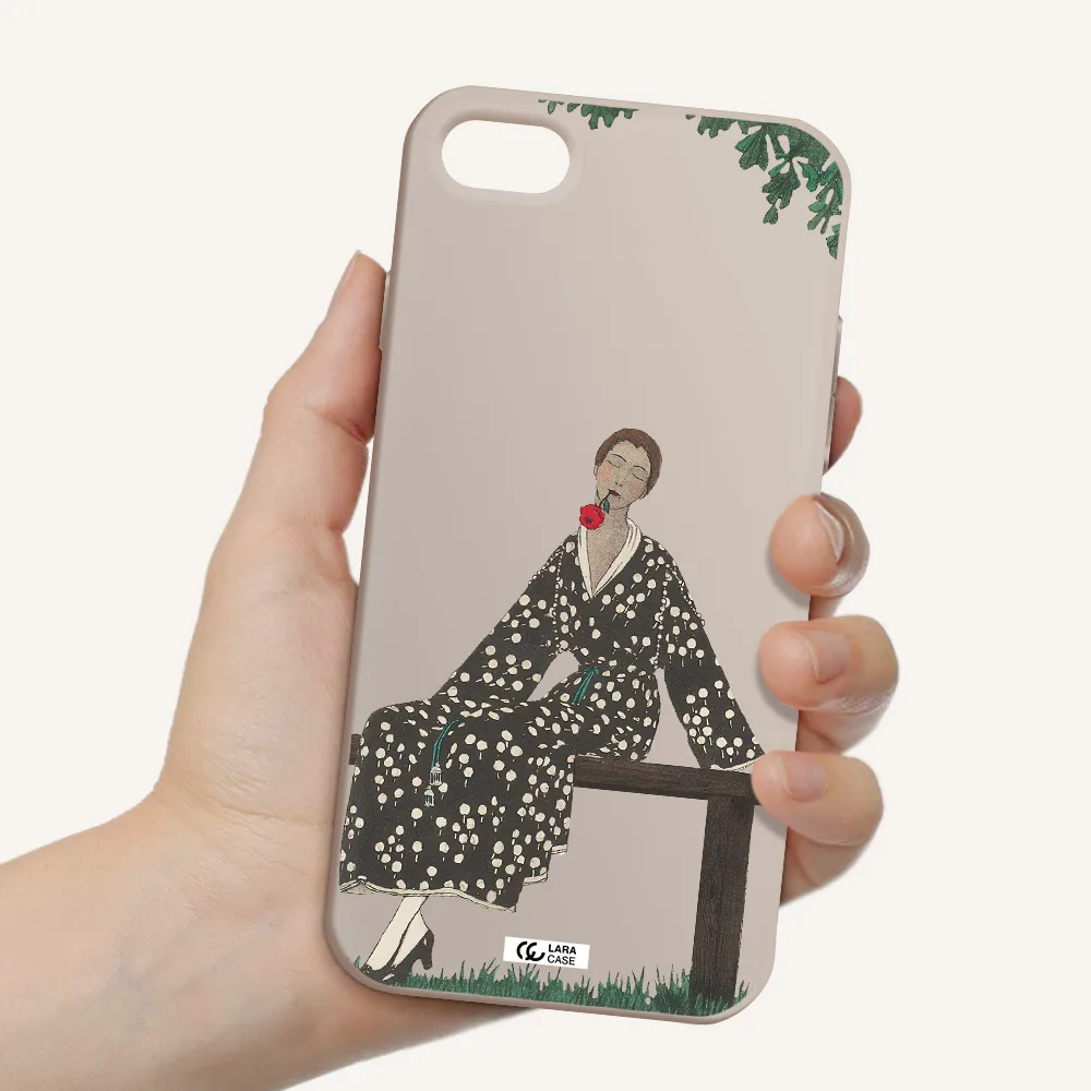 a woman sitting on a bench Apple iPhone 7 Silicone Stone Case