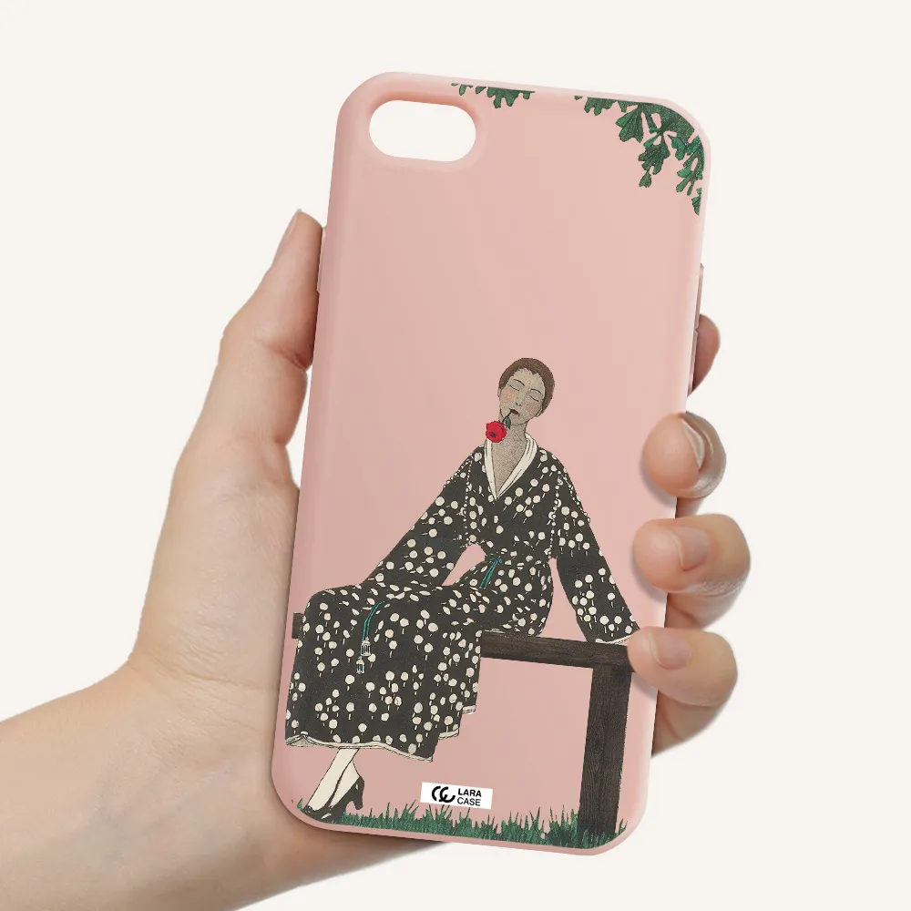 a woman sitting on a bench Apple iPhone 8 Silicone pastel pink Case