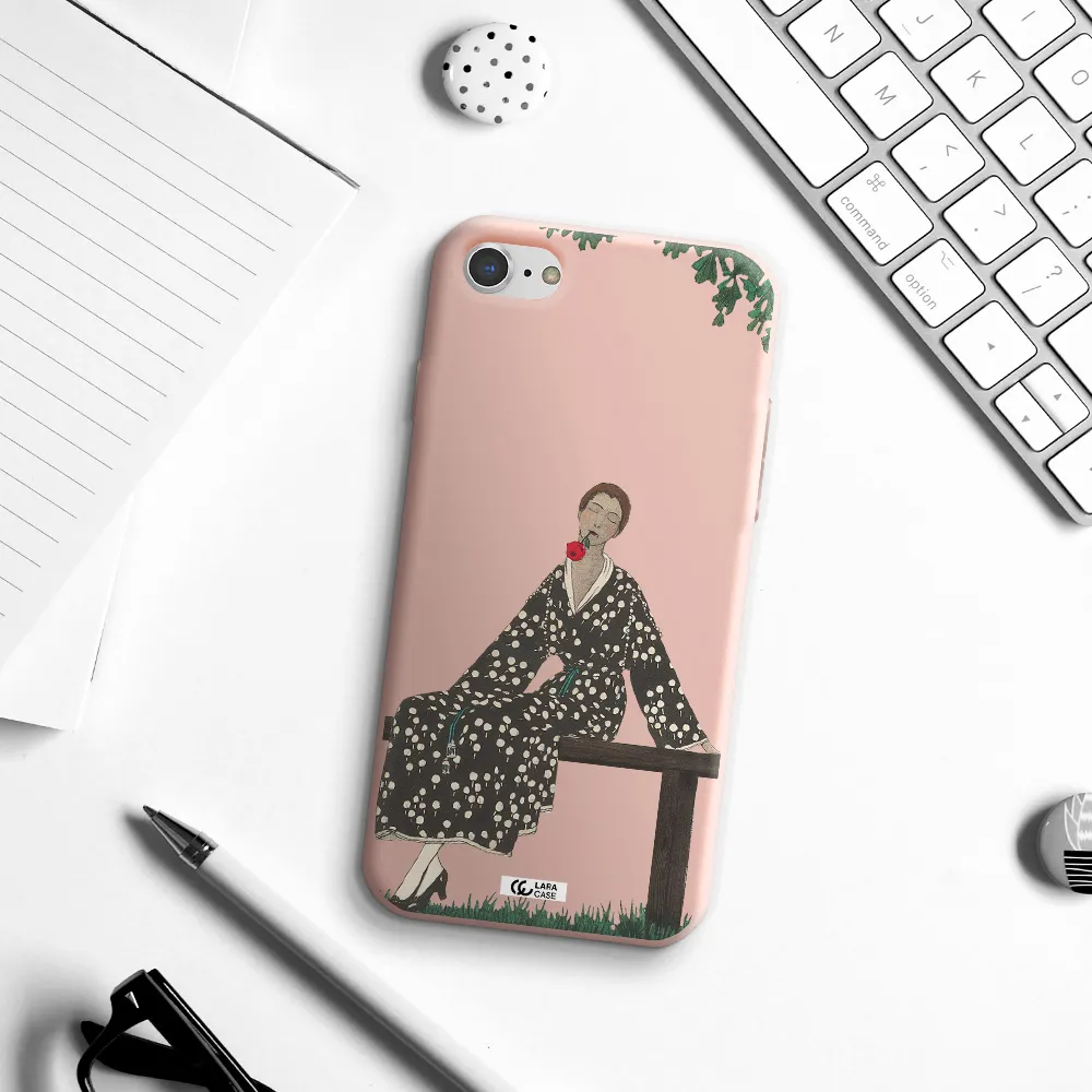 a woman sitting on a bench Apple iPhone 8 Silicone pastel pink Case