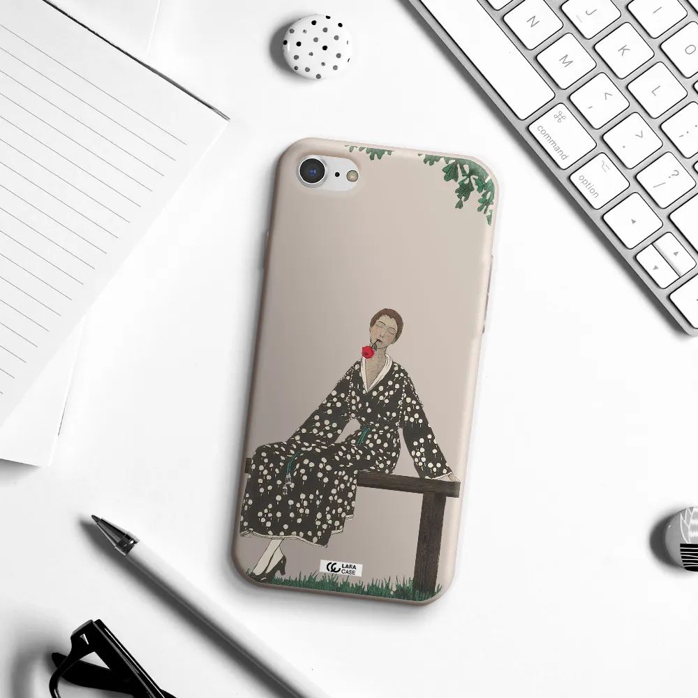 a woman sitting on a bench Apple iPhone 8 Silicone Stone Case