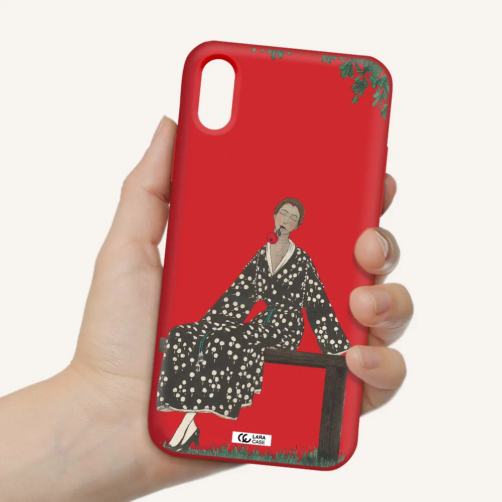 a woman sitting on a bench Apple iPhone X Silicone Imperial Red Case