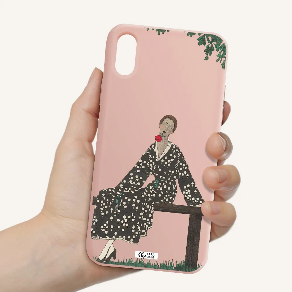 a woman sitting on a bench Apple iPhone X Silicone pastel pink Case