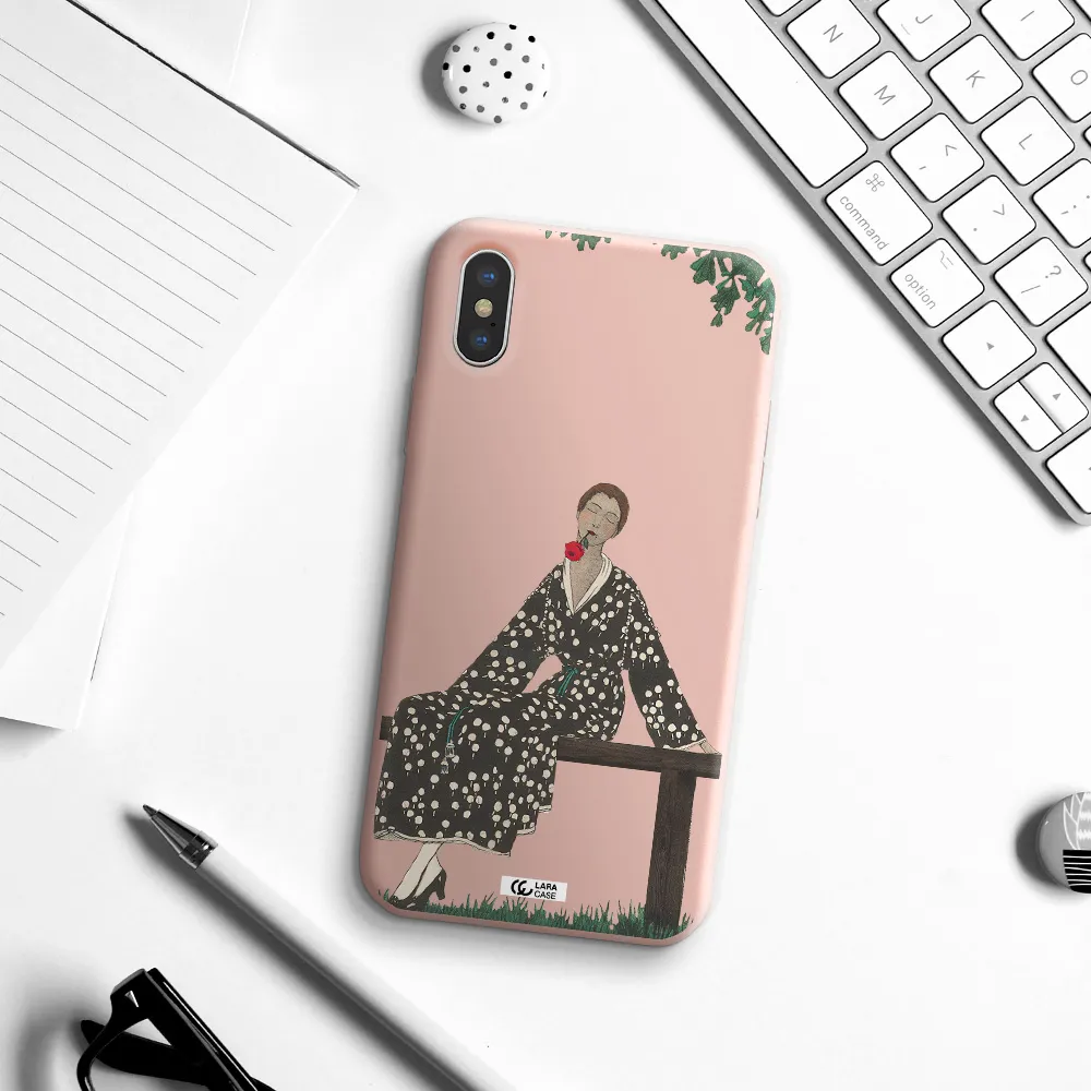 a woman sitting on a bench Apple iPhone X Silicone pastel pink Case