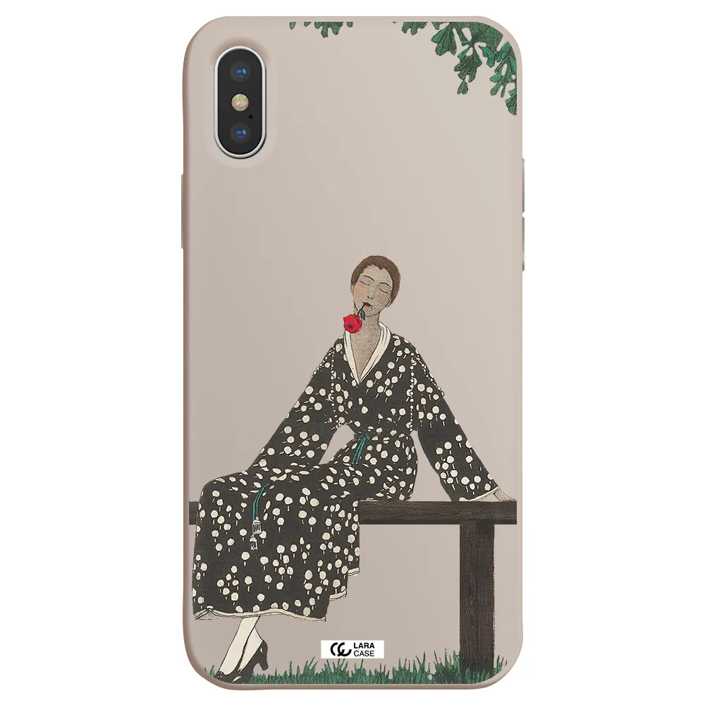 a woman sitting on a bench Apple iPhone XS Silicone Stone Case