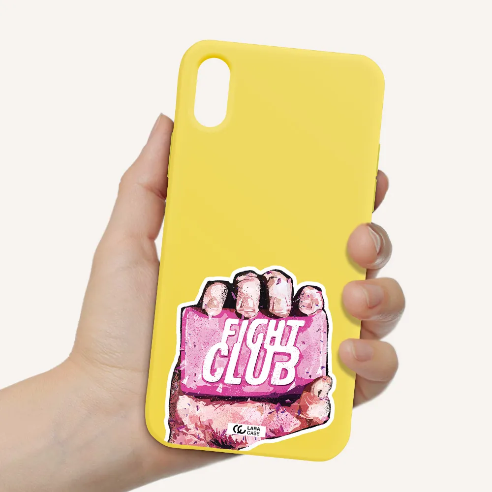 a hand holding a pink bag Apple iPhone XS Silicone canary yellow Case