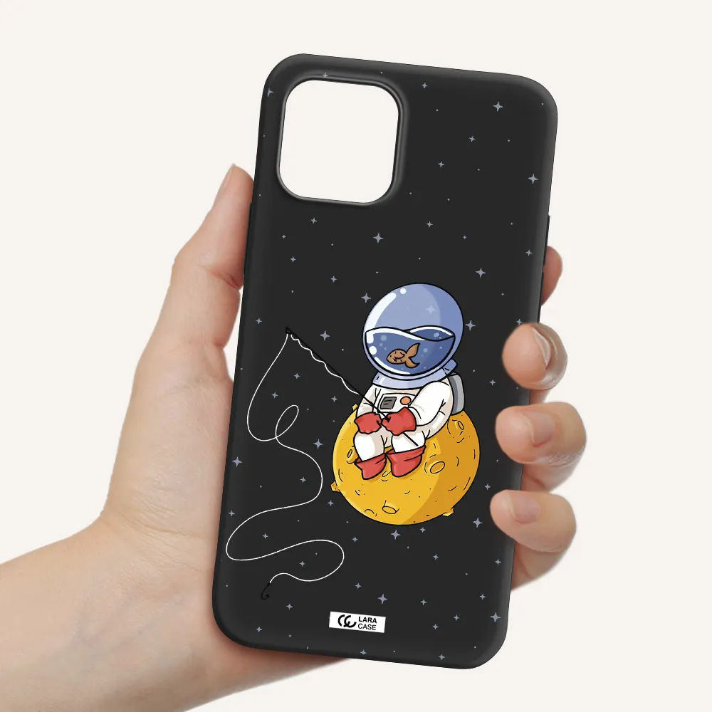 a cartoon of an astronaut sitting on a moon Apple iPhone 12 Silicone black Case