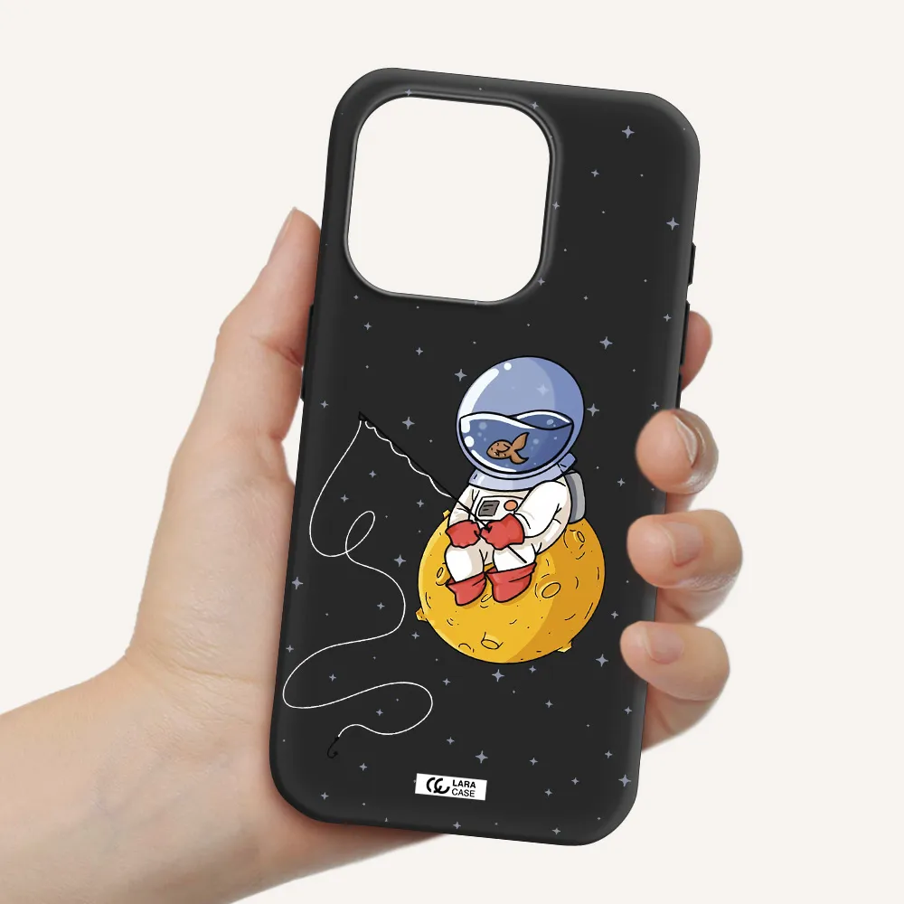 A Cartoon Of An Astronaut Sitting On A Moon Apple Iphone 15 Pro Silicone Black Case