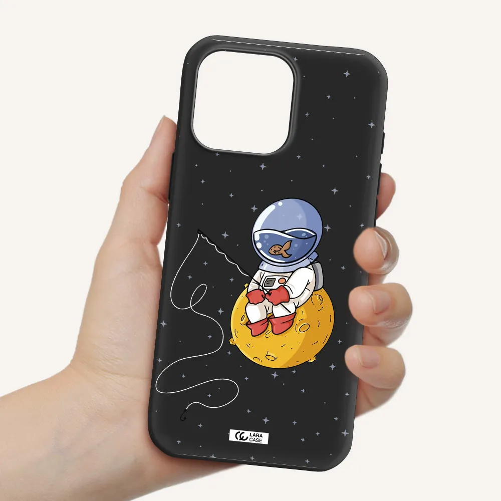 A Cartoon Of An Astronaut Sitting On A Moon Apple Iphone 16 Pro Max Silicone Black Case