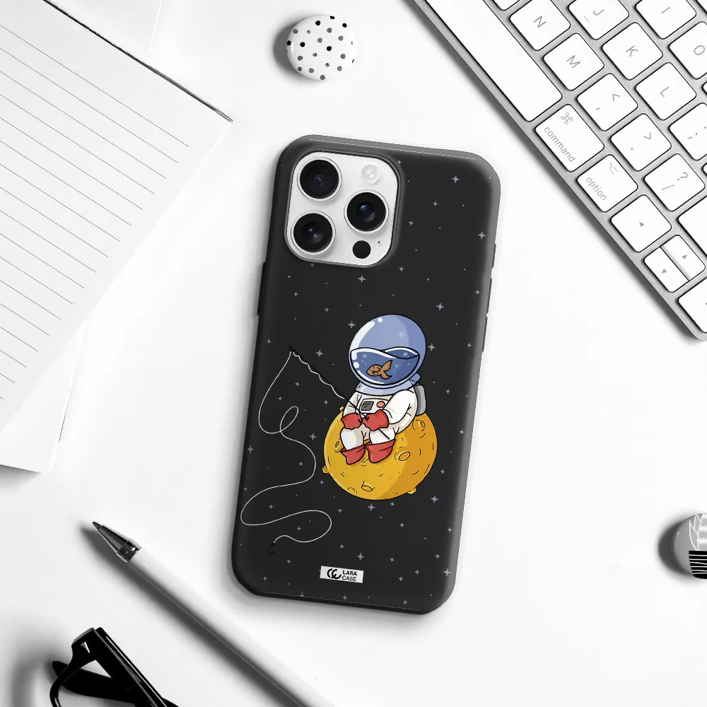 A Cartoon Of An Astronaut Sitting On A Moon Apple Iphone 16 Pro Max Silicone Black Case