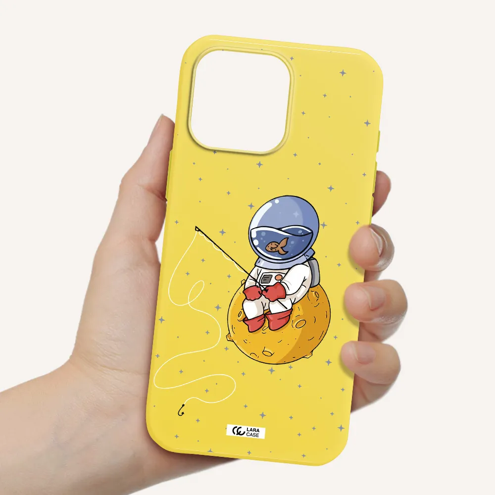 A Cartoon Of An Astronaut Sitting On A Moon Apple Iphone 16 Pro Max Silicone Canary Yellow Case