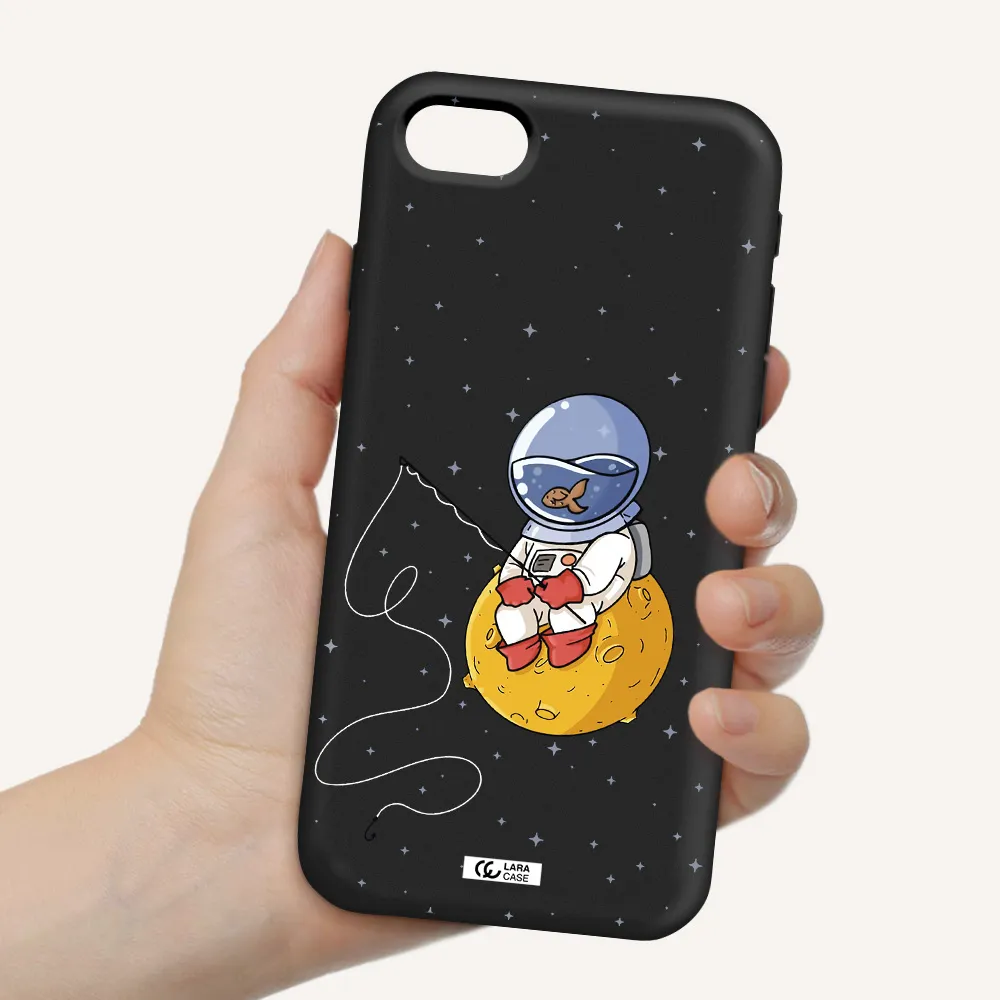 a cartoon of an astronaut sitting on a moon Apple iPhone se 2020 Silicone black Case
