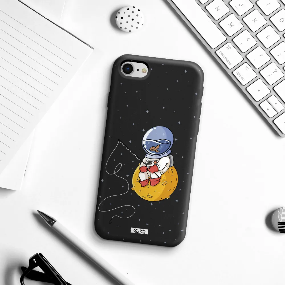 a cartoon of an astronaut sitting on a moon Apple iPhone se 2020 Silicone black Case