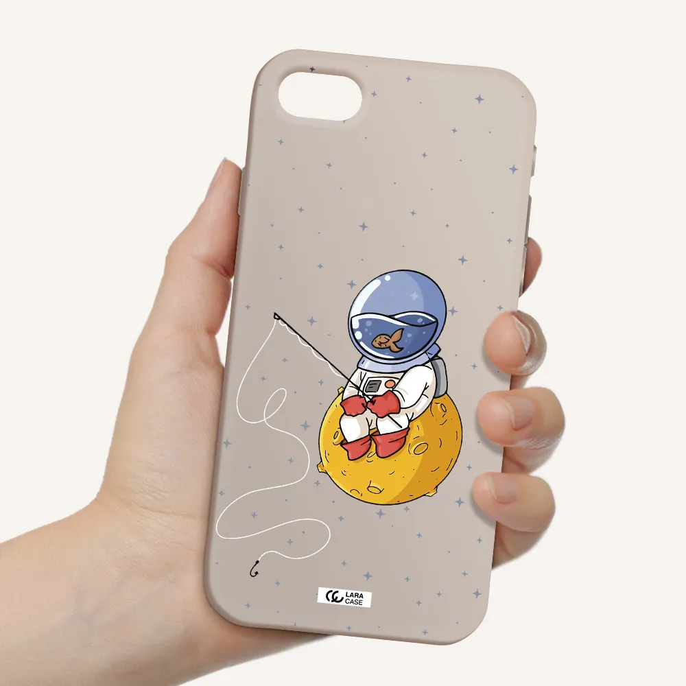 a cartoon of an astronaut sitting on a moon Apple iPhone se 2020 Silicone Stone Case