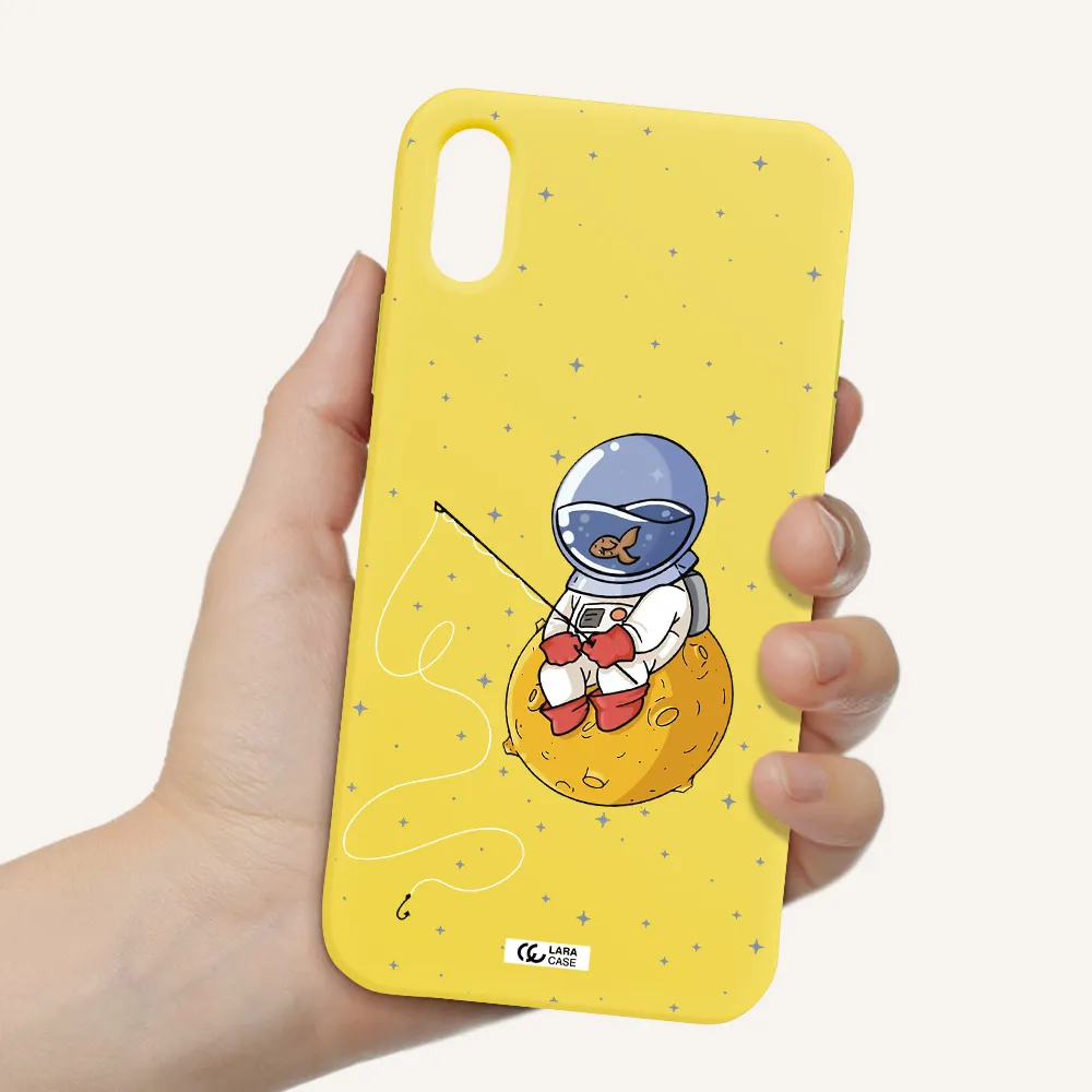 a cartoon of an astronaut sitting on a moon Apple iPhone XS Silicone canary yellow Case