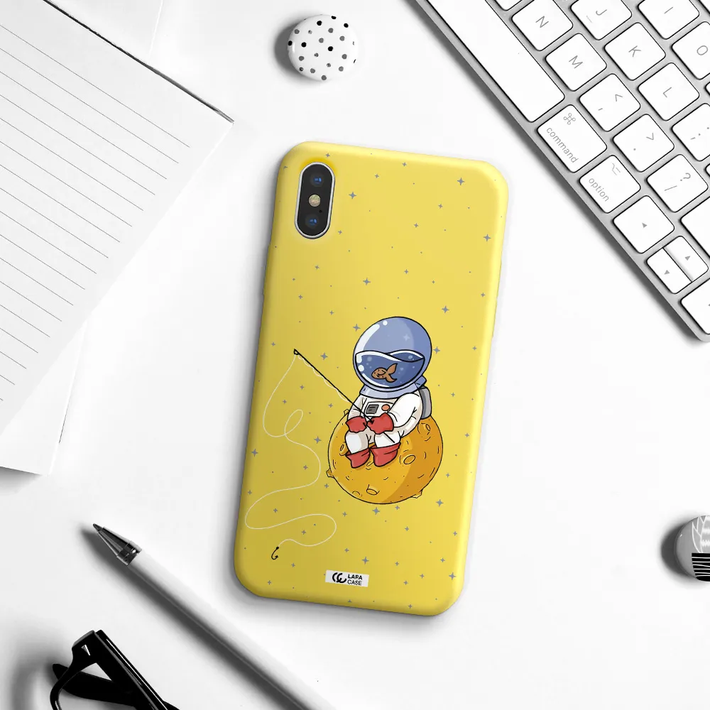 a cartoon of an astronaut sitting on a moon Apple iPhone XS Silicone canary yellow Case
