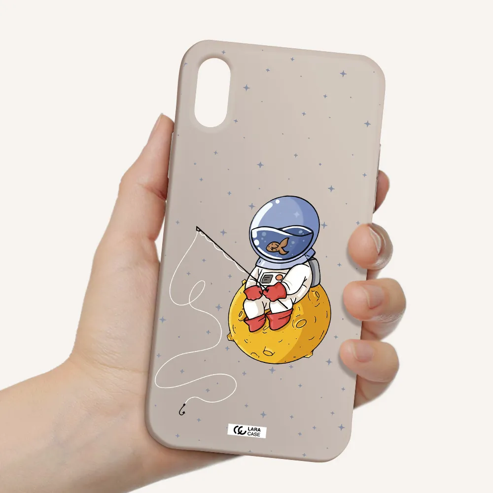 a cartoon of an astronaut sitting on a moon Apple iPhone XS Silicone Stone Case