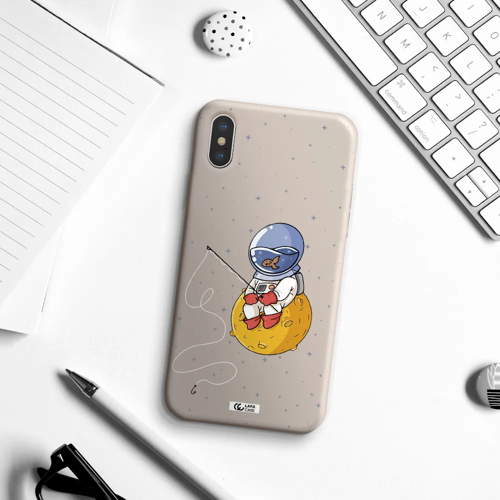 a cartoon of an astronaut sitting on a moon Apple iPhone XS Silicone Stone Case