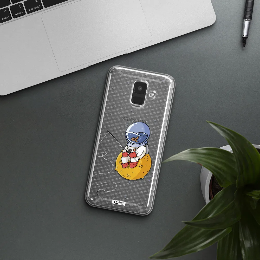 a cartoon of an astronaut sitting on a moon Samsung A6 Clear TPU Case