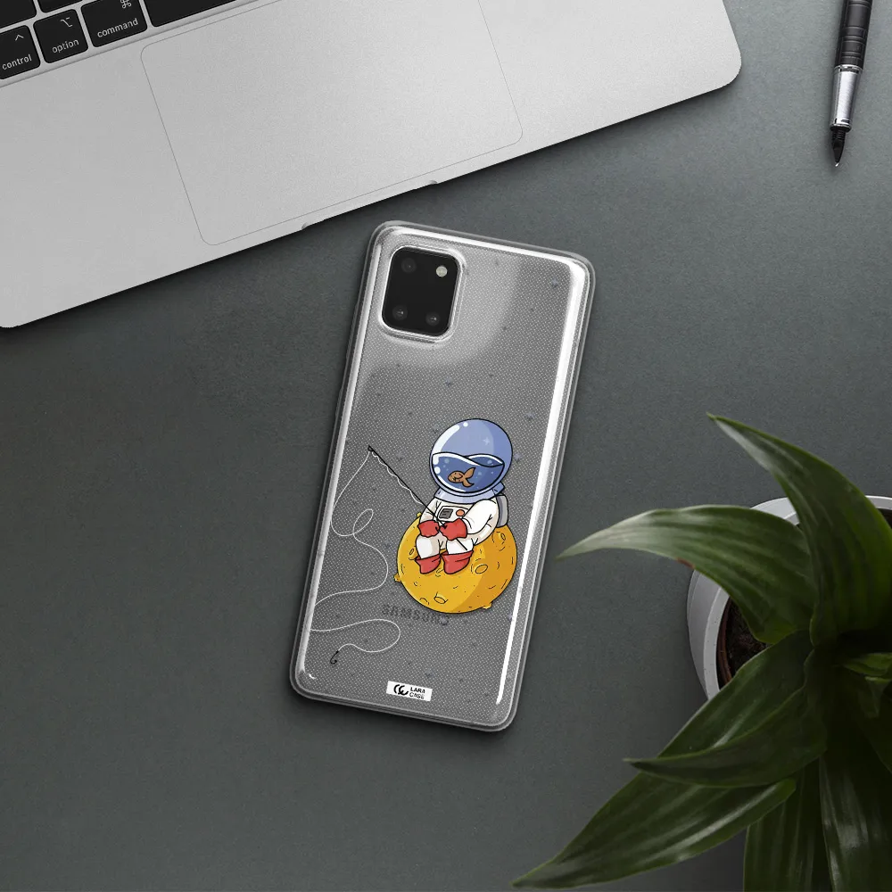 a cartoon of an astronaut sitting on a moon Samsung A81 Clear TPU Case